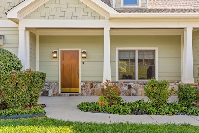 doorway to property with a porch