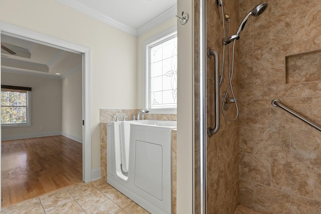 bathroom featuring washer / clothes dryer, crown molding, shower with separate bathtub, and hardwood / wood-style flooring