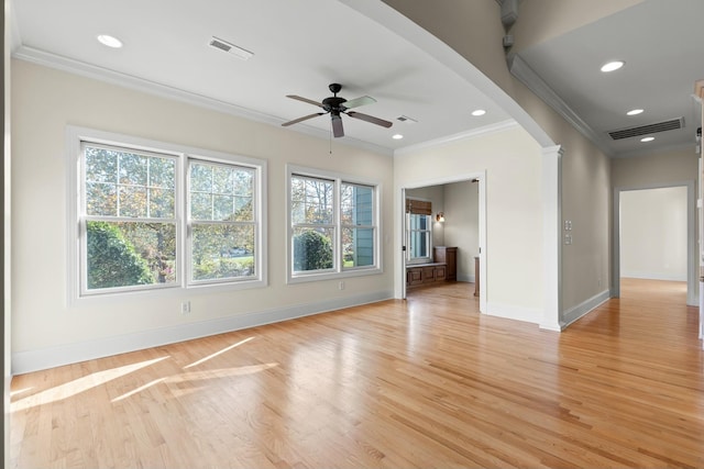 unfurnished living room with ceiling fan, crown molding, and light hardwood / wood-style flooring