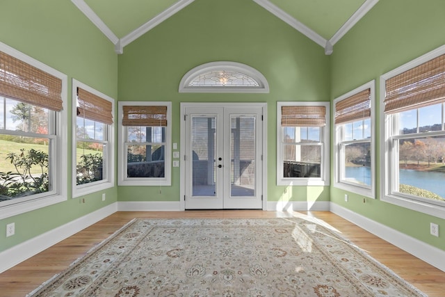 unfurnished sunroom featuring french doors and lofted ceiling