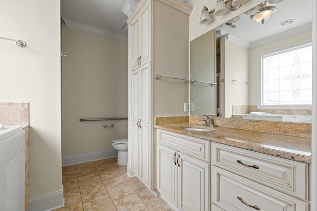 bathroom featuring washer / clothes dryer, crown molding, vanity, and toilet