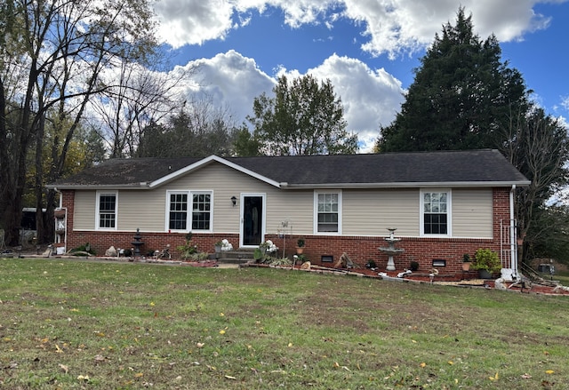 single story home featuring a front yard