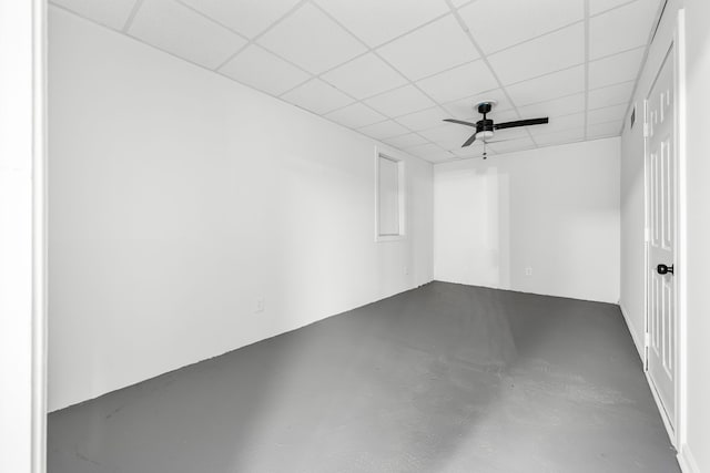 spare room featuring a paneled ceiling and ceiling fan