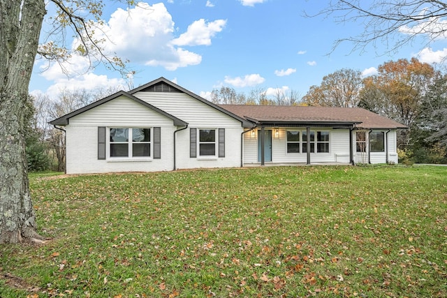 back of house featuring a lawn