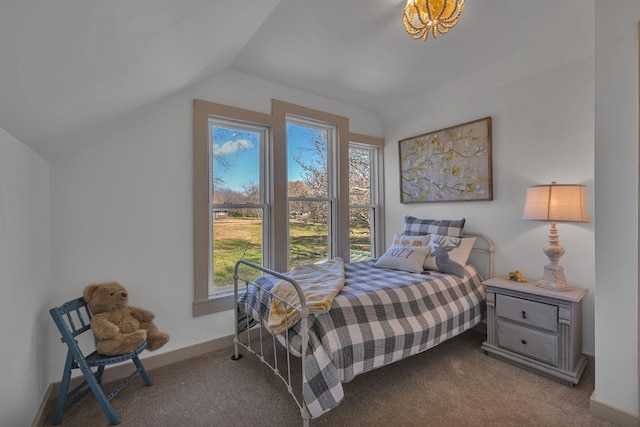 carpeted bedroom featuring lofted ceiling