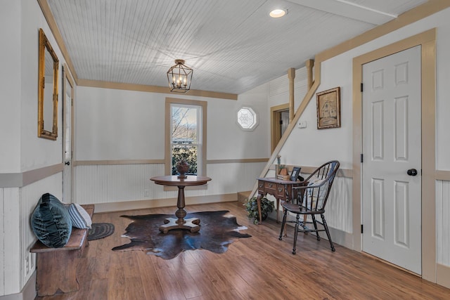 living area featuring a chandelier and hardwood / wood-style flooring