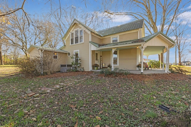 view of front of house with central air condition unit and a porch