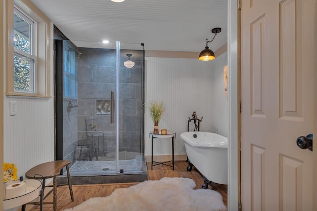 bathroom featuring plus walk in shower and wood-type flooring