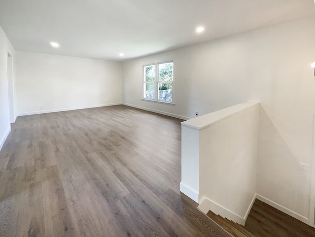 empty room with wood-type flooring