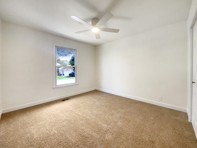 carpeted empty room with ceiling fan