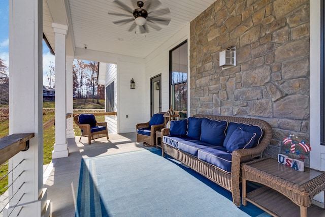 view of patio with ceiling fan, covered porch, and an outdoor living space