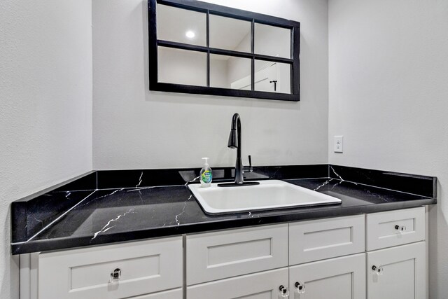 kitchen with white cabinets and sink