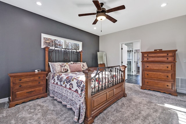 carpeted bedroom with connected bathroom and ceiling fan