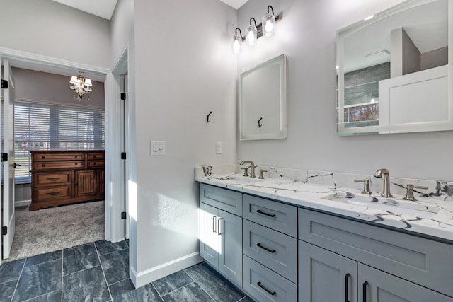 bathroom featuring vanity and an inviting chandelier