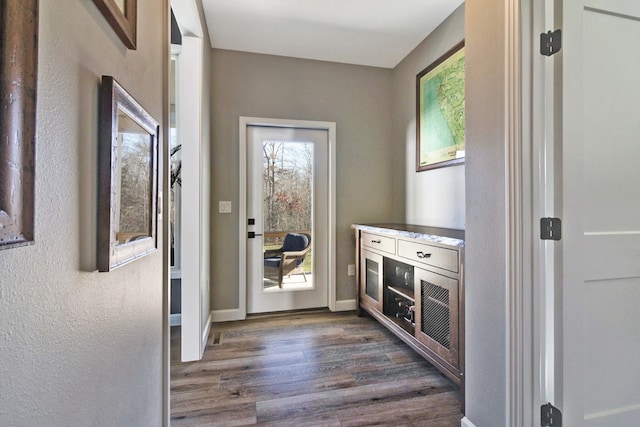 kitchen with dark hardwood / wood-style flooring