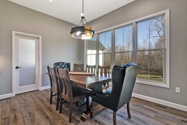 dining area featuring dark hardwood / wood-style floors