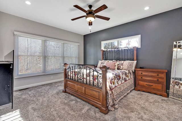 bedroom featuring ceiling fan and carpet