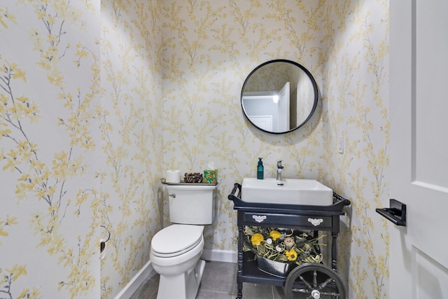 bathroom featuring tile patterned floors, vanity, and toilet