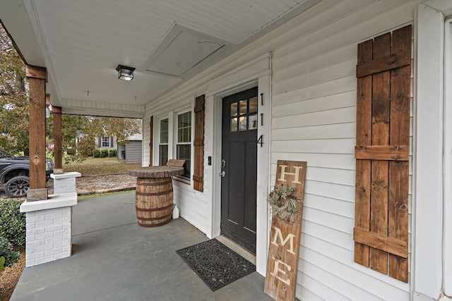 entrance to property with a porch