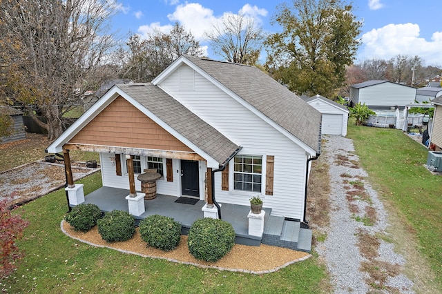 view of front of home featuring covered porch and a front yard