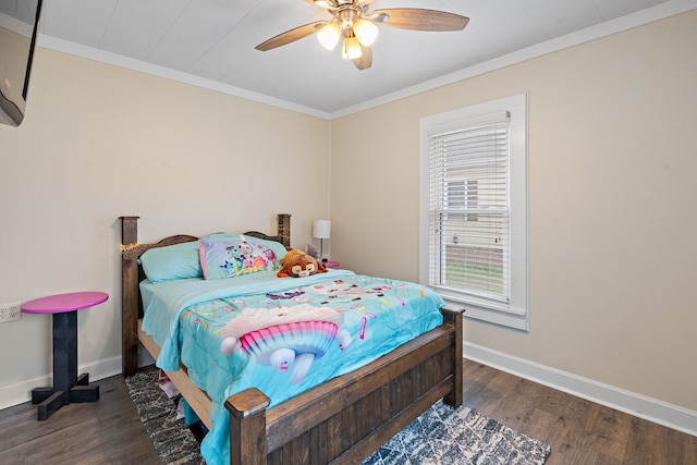 bedroom featuring ceiling fan, dark hardwood / wood-style flooring, and crown molding