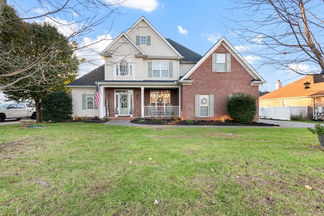 view of front of property featuring a front yard and a porch