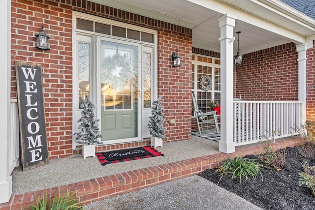 property entrance with covered porch