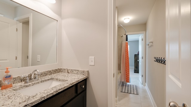 bathroom with bathing tub / shower combination, tile patterned flooring, and vanity