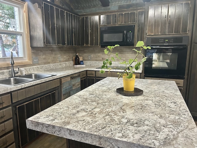 kitchen with dark hardwood / wood-style flooring, tasteful backsplash, dark brown cabinetry, sink, and black appliances