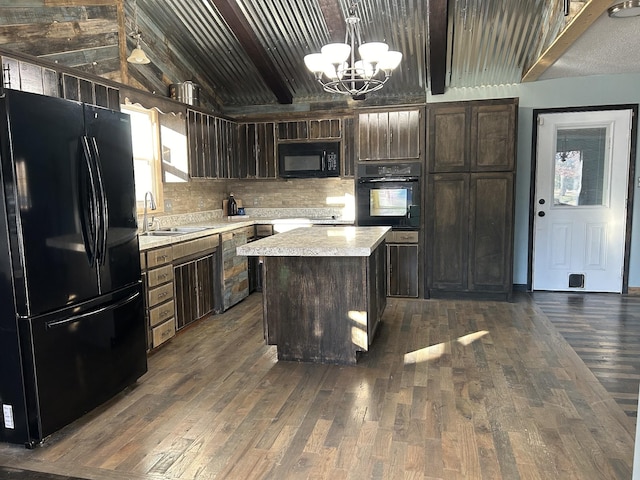 kitchen featuring dark brown cabinets, sink, black appliances, a notable chandelier, and a kitchen island