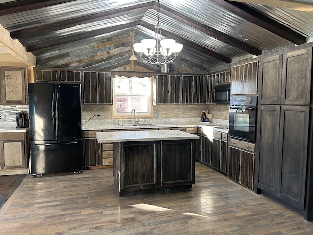 kitchen with sink, black appliances, lofted ceiling with beams, a kitchen island, and hanging light fixtures