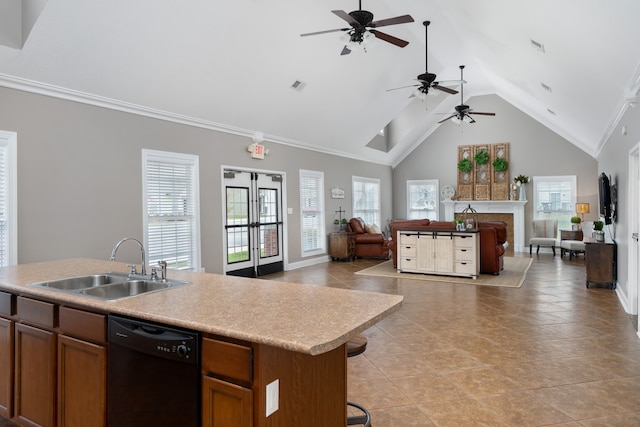 kitchen featuring dishwasher, sink, high vaulted ceiling, an island with sink, and light tile patterned floors