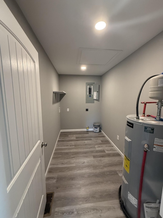 1260 Hutchins Rd, Mc Minnville, TN 37110 - laundry room with wood-type flooring, electric panel, and water heater