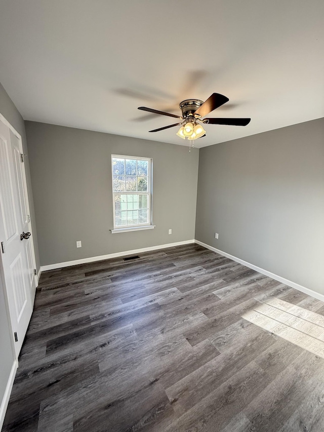 1260 Hutchins Rd, Mc Minnville, TN 37110 - spare room with dark hardwood / wood-style floors and ceiling fan