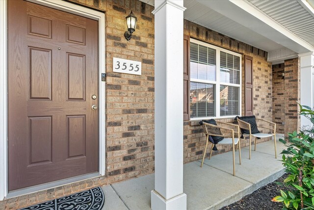 entrance to property with a porch