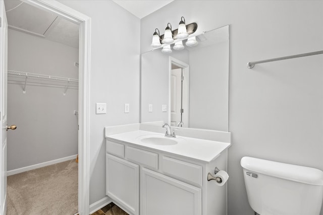 bathroom with toilet and vanity