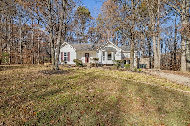 single story home featuring a front lawn