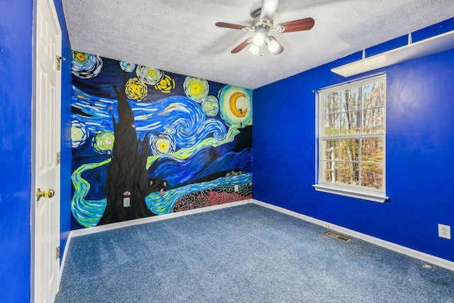 interior space with ceiling fan, carpet floors, and a textured ceiling