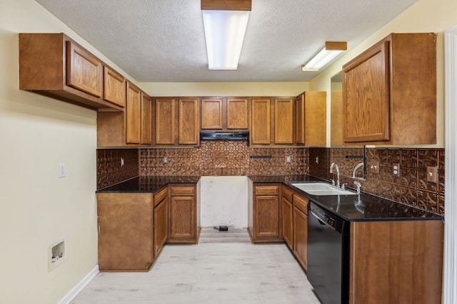 kitchen featuring sink, black dishwasher, a textured ceiling, decorative backsplash, and light wood-type flooring