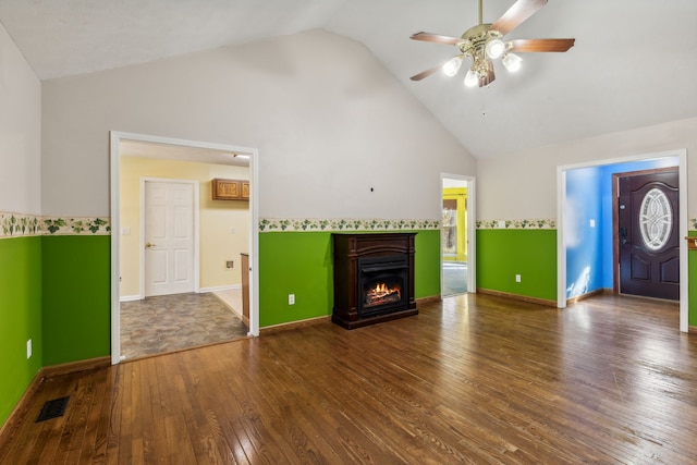 unfurnished living room featuring ceiling fan, wood-type flooring, and high vaulted ceiling