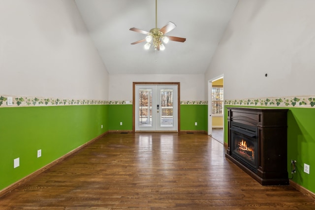 unfurnished living room featuring french doors, high vaulted ceiling, ceiling fan, and dark wood-type flooring