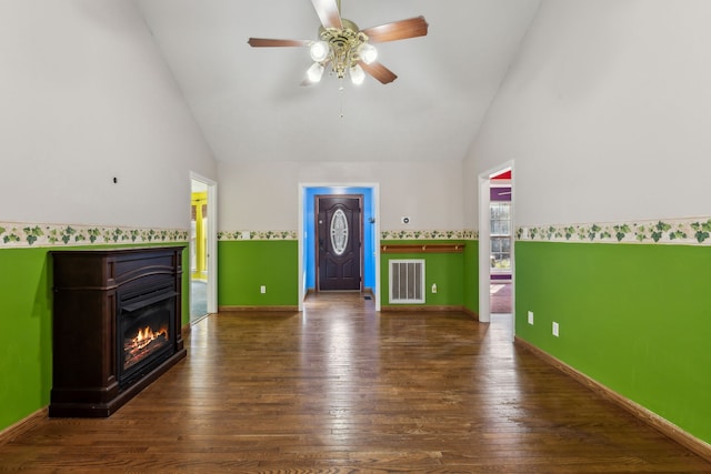 unfurnished living room with ceiling fan, high vaulted ceiling, and dark hardwood / wood-style floors