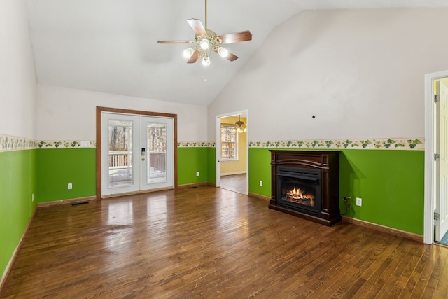 unfurnished living room with ceiling fan, french doors, high vaulted ceiling, and hardwood / wood-style flooring