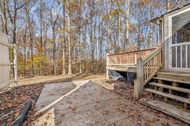 view of yard featuring a wooden deck and a patio area