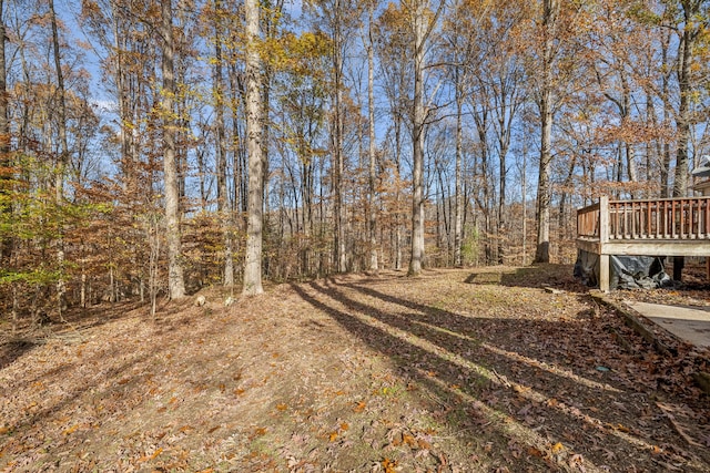 view of yard with a wooden deck