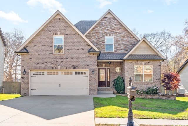 craftsman inspired home with a garage and a front lawn