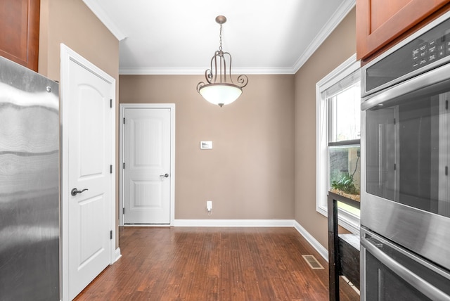 unfurnished dining area with dark hardwood / wood-style floors and ornamental molding