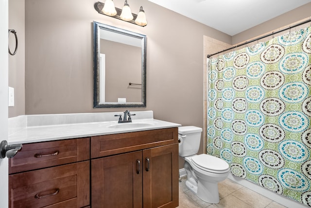 bathroom with tile patterned floors, vanity, and toilet