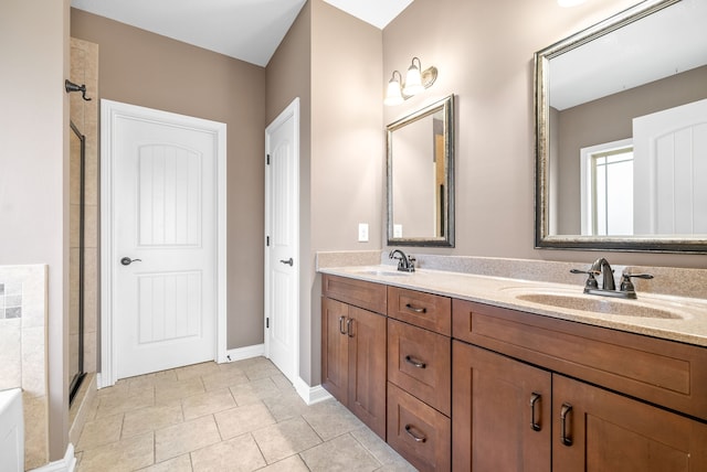 bathroom featuring tile patterned floors, vanity, and an enclosed shower