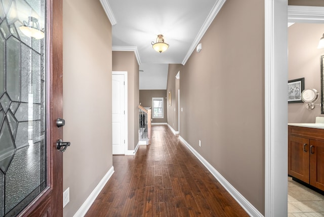 hallway featuring light hardwood / wood-style flooring and ornamental molding